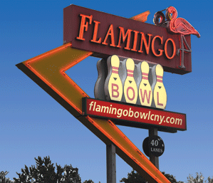 The Flamingo Bowl roadside sign — a retro neon sign with a pink flamingo, the word FLAMINGO in red, BOWL across four bowling pins, flamingobowlcny.com, and 40 LANES.